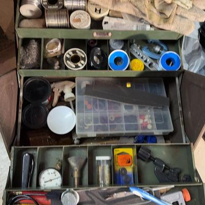 Metal Toolbox Filled With Plumbing Supplies