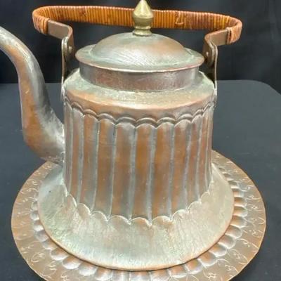 Lot 125:  Antique Hand-Hammered Copper Teapot and Matching Charger Plate Set