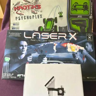 Lot 152:  STEM & Action Fun Lot – Laser X, Kaotiks RC Car, and LCD Digital Microscope