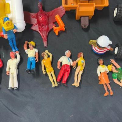Lot 414: Vintage Mixed Toy Vehicle and Action Figure Lot – Playskool, Fisher-Price, and More