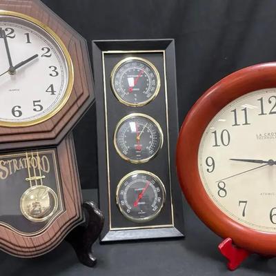 Lot 127:  Vintage Wall & Desk Clock Trio – Stratford Pendulum, La Crosse Atomic, and Weather Station