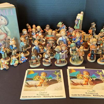 Extensive Goebel M.I. Hummel Figurine Collection with Collector Guides