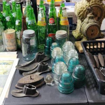 Vintage soda bottles insulators, and cuckoo clock weights