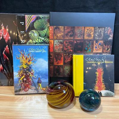 Glass paperweights and unopened chihuly books