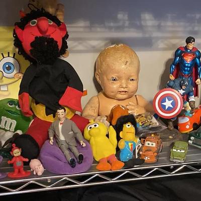 Toy & Collectible Display Featuring Action Figures, Vintage Cars & Pop Culture Icons