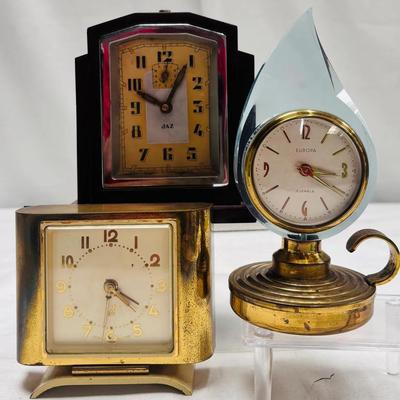 Architectural Art Deco and Blue Lucite Novelty Clocks: Jaz & Europa Trio