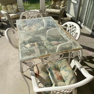 Patio Dining Set – Glass-Top Metal Table + 4 Plastic Chairs w/ Cushions