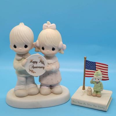 (2) Precious Moments Figurines: "Happy Anniversary", "God Bless Those Who Serve"