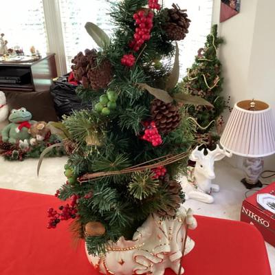 Tabletop christmas floral arrangement in white container