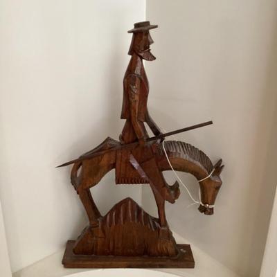 Hand carved wooden statue of don quixote on his horse rocinante