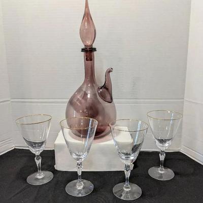 Blenko amethyst art glass decanter and (4) Fostoria Aurora water goblets with a gold rim