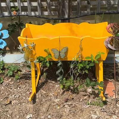 Repurposed Yellow Baby Crib Planter with Metal Yard Décor