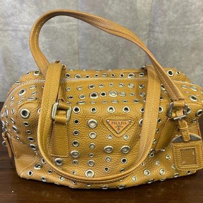 Prada Brown Leather Handbag with Metal Grommet Design