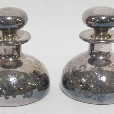Sale Photo Thumbnail #158: 1158	PAIR OF ANTIQUE 999 SILVER OVERLAY TOOLED PERFUME BOTTLES, EACH APPROXIMATELY 3 1/2 IN H
