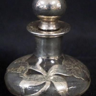 Sale Photo Thumbnail #156: 1156	ANTIQUE STERLING SILVER OVERLAY GLASS PERFUME BOTTLE, APPROXIMATELY 3 IN H
