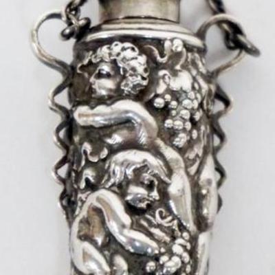 Sale Photo Thumbnail #182: 1182	TIFFANY & CO. REPOUSSE STERLING SILVER LADIES SCENT PERFUME BOTTLE WITH IMAGES OF PUTTIS
