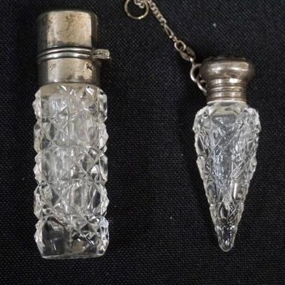 Sale Photo Thumbnail #179: 1179	2 STERLIN SILVER AND CUT GLASS LADIES SCENT PERFUME BOTTLES, TALLEST APPROXIMATELY 2 3/4 IN
