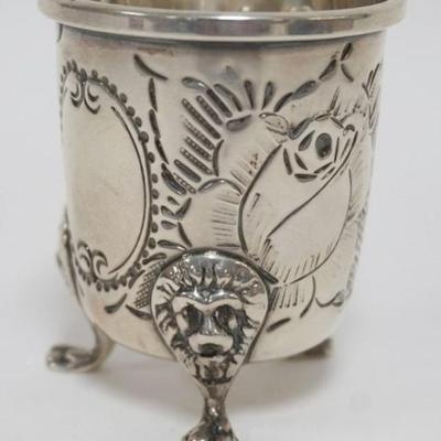 Sale Photo Thumbnail #204: 1204	STERLING SILVER B & M HAND CHASED FOOTED CUP, LIONS HEADS AND PAW FEET, 2.2 OZT
