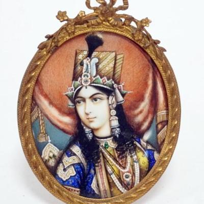 Sale Photo Thumbnail #131: 1131	HAND PAINTED IMAGE OF INDIAN EMPRESS IN FRENCH FRAME, STERN BROS NY, APPROXIMATELY 3 IN X 2 1/4 IN
