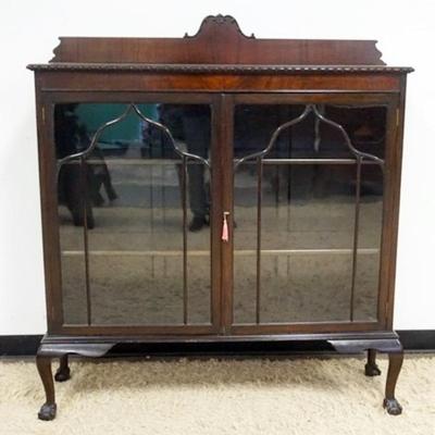 Sale Photo Thumbnail #246: 1246	MAHOGANY DOUBLE DOOR BOOKCASE ON BALL AND CLAW FEET AND 2 ADJUSTABLE SHELVES, APPROXIMATELY 50 IN X 14 IN X 54 IN W
