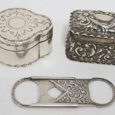 Sale Photo Thumbnail #200: 1200	GROUP INCLUDING 2 STERLING SILVER BOXES AND STERLING SILVER CIGAR CUTTER
