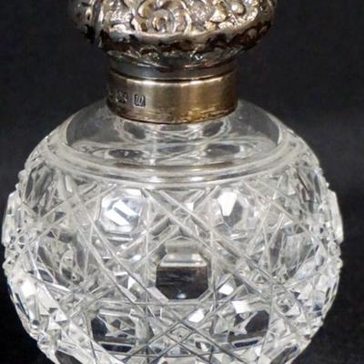 Sale Photo Thumbnail #152: 1152	ANTIQUE CUT GLASS PERFUME WITH HINGED SILVER LID AND STOPPER, HALL MARKS, APPROXIMATELY 4 IN H
