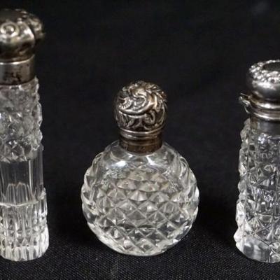 Sale Photo Thumbnail #180: 1180	3 SILVER TOPPED CUT GLASS LADIES SCENT PERFUME BOTTLES, TALLEST APPROXIMATELY 3 IN
