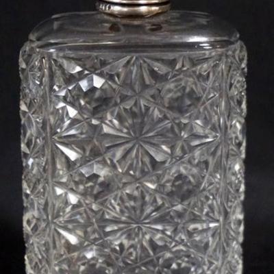 Sale Photo Thumbnail #164: 1164	CUT GLASS FLASK WITH REPOUSSE STERLING LID, APPROXIMATELY 4 IN H
