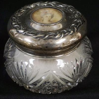 Sale Photo Thumbnail #142: 1142	STERLING SILVER & CUT GLASS DRESSER BOX, LID HAS PORTRAIT IN CENTER, APPROXIMATELY 4 IN X 3 3/4 IN HIGH
