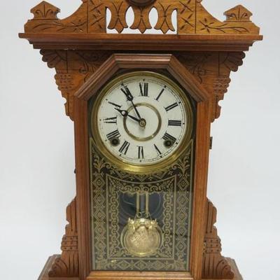 1002	EN WELCH WALNUT CASED GINGERBREAD SHELF CLOCK, APPROXIMATELY 15 IN X 5 IN X 22 IN HIGH
