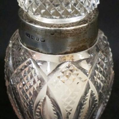 Sale Photo Thumbnail #151: 1151	CUT GLASS DRESSER BOTTLE WITH SILVER COLLAR, APPROXIMATELY 3 1/2 IN H
