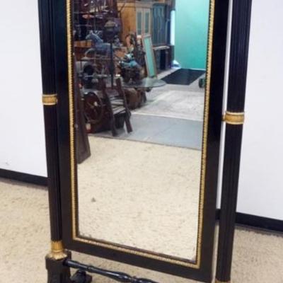 Sale Photo Thumbnail #247: 1247	ANTIQUE EMPIRE CHEVAL MIRROR WITH CORINTHIAN COLUMNS IN EBONIZED FINISH WITH GILT ACCENTS, APPROXIMATELY 36 IN X 20 IN X 78 IN H, MIRROR NEED RESILVERING AND SOME LOSS TO CARVING
