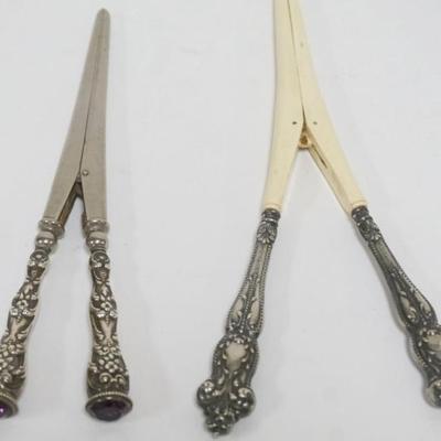 Sale Photo Thumbnail #201: 1201	STERLING REPOUSSE SILVER HANDLED LADIES GLOVE STRETCHERS, 1 WITH AMYTHYST JEWEL END, LARGEST APPROXIMATELY 8 IN
