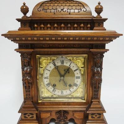 1005	GERMAN BRACKET CLOCK CARVED, WALNUT CASE W/BEVELED GLASS SIDES, RSM R SCHNEKENBURGER, APPROXIMATELY 8 IN X 13 IN X 19 IN HIGH
