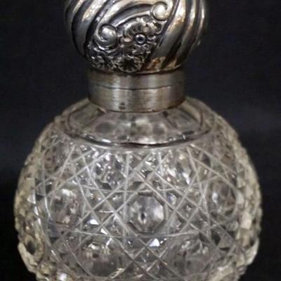 Sale Photo Thumbnail #153: 1153	ANTIQUE CUT GLASS PERFUME WITH HINGED SILVER LID AND STOPPER, HALL MARKS, APPROXIMATELY 4 1/2 IN H
