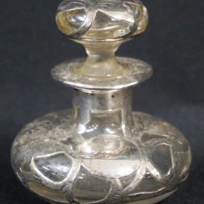 Sale Photo Thumbnail #160: 1160	ANTIQUE SILVER OVERLAY PERFUME BOTTLE, APPROXIMATELY 3 1/4 IN H
