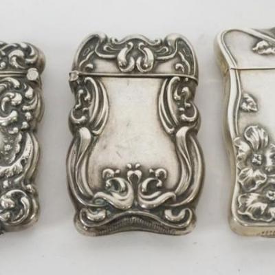 Sale Photo Thumbnail #207: 1207	GROUP OF 3 REPOUSSE STERLING MATCH SAFES, 2.1 OZT
