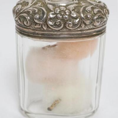 Sale Photo Thumbnail #147: 1147	ANTIQUE SILVER LID OVAL DRESSER JAR, APPROXIMATELY 3 IN X 2 IN X 4 IN H
