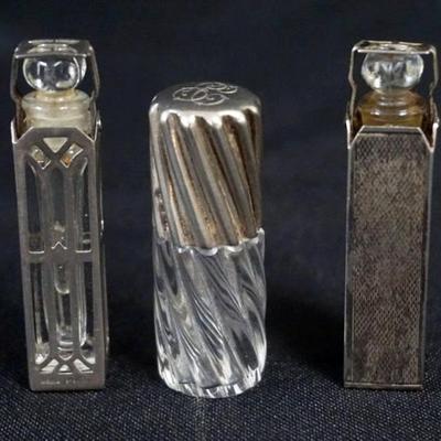 Sale Photo Thumbnail #177: 1177	GROUP OF 3 SILVER CASED AND 1 LID PERFUMES, TALLEST APPROXIMATELY 2 1/2 IN

