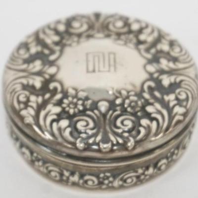 Sale Photo Thumbnail #196: 1196	REPOUSSE TIFFANY & CO. STERLING SILVER ROUND TRINKET BOX WITH GOLD WASH INTERIOR, APPROXIMATELY 2 1/4 IN X 1 IN, 1.7 OZT

