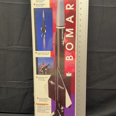 Four Launch Rockets And Plastic Astronaut Helmet 