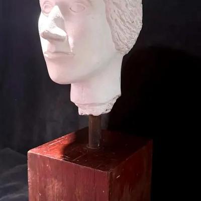 Plaster bust on wooden block