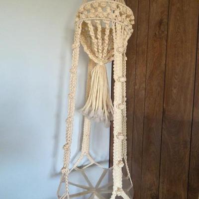 Vintage Macrame Plant Hanger with a Glass Table.