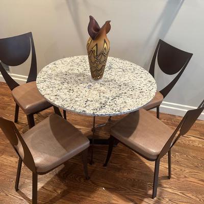 Stone Bistro Table With Modern Metal Chairs