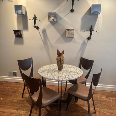 Stone Bistro Table With Modern Metal Chairs