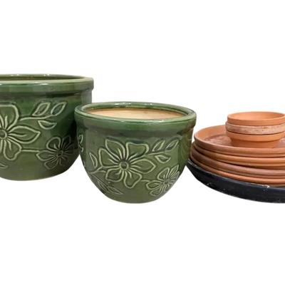 Two Green Glazed Flower Pots And Terracotta Saucers