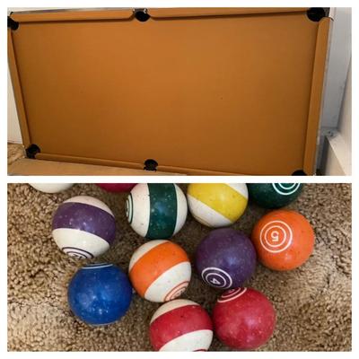 Retro pool table with ball return and legs that fold for storage