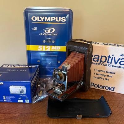 Vintage Cameras (3) With Olympus Digital, Polaroid Captiva SLR, Kodak Folding Pocket