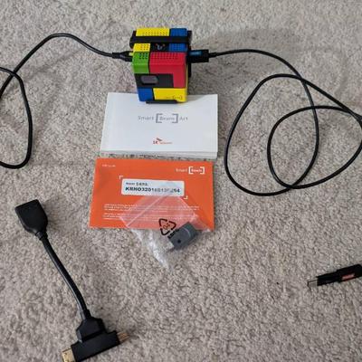 WST073 "Rubik's Cube" Smartphone Wall Projector and HDMI Accessories from SK Telecom.