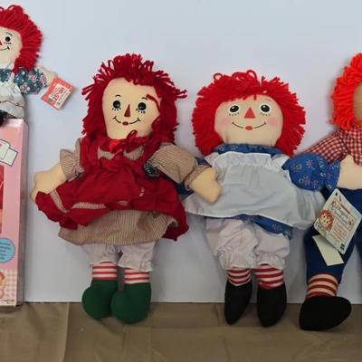 Collection of Raggedy Ann and Andy dolls.\n\n